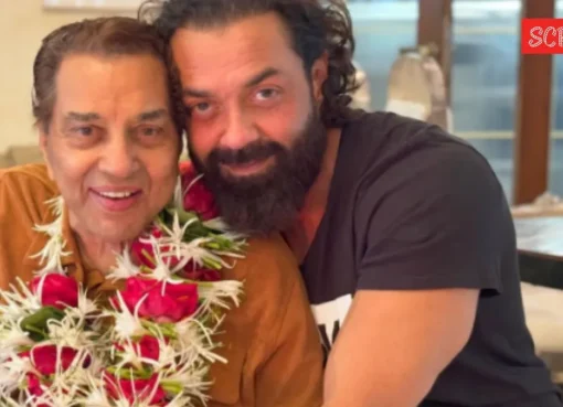 Bobby Deol looking emotional while speaking.