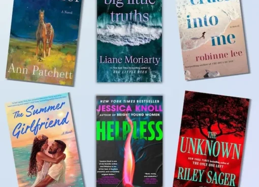 A stack of colorful new books with a sunny, summer background.