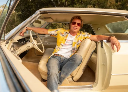 Brad Pitt as Cliff Booth, looking cool and casual, from the movie.