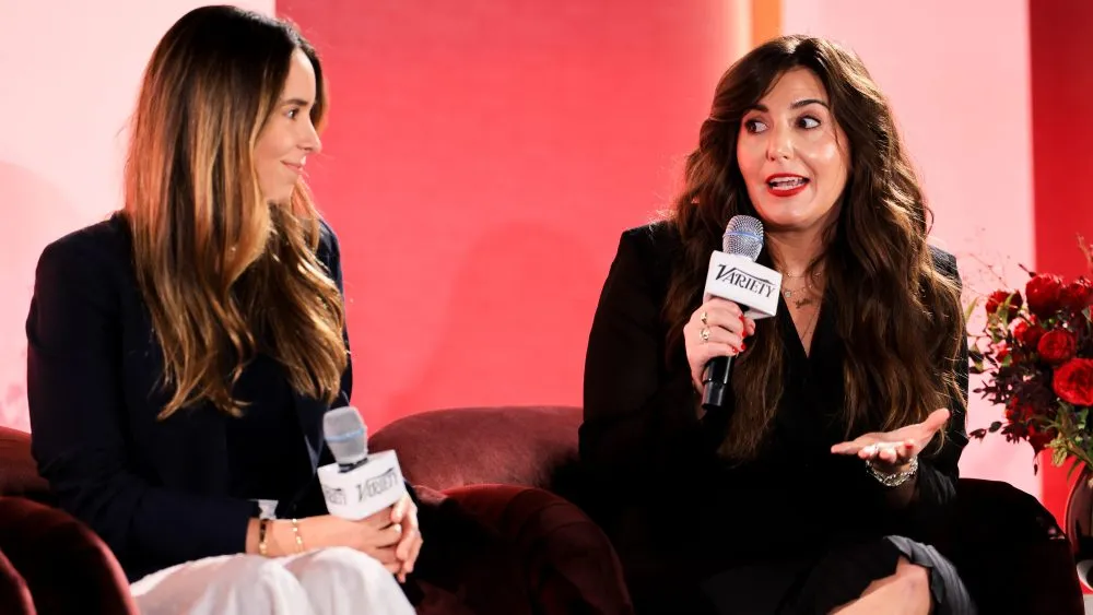 Two women talking about marketing trends for young consumers.