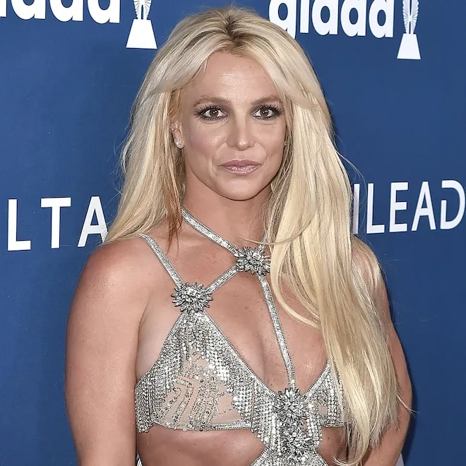 Britney Spears smiling on a stage.