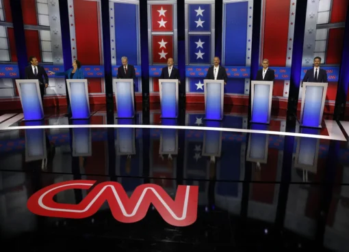 Seven candidates on a debate stage in California.