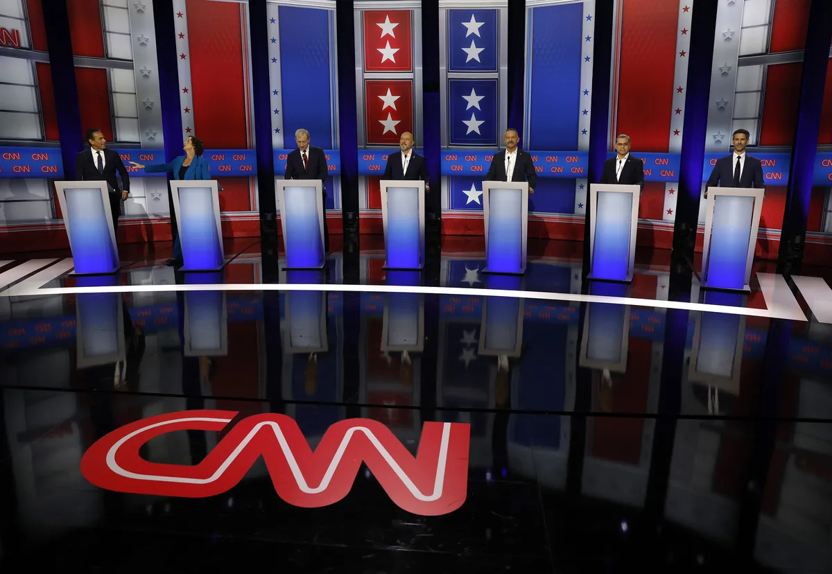 Seven candidates on a debate stage in California.