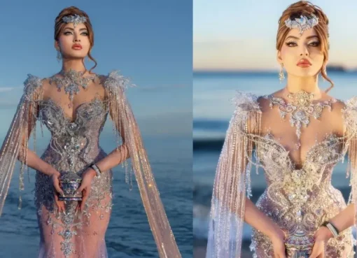 Urvashi Ratuela posing in a sparkling couture gown and elaborate headpiece at Cannes.