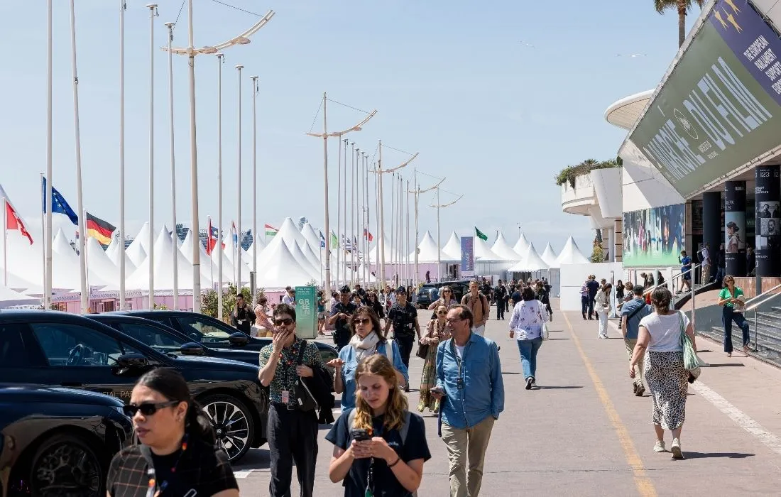 An aerial view of the Palais des Festivals and the crowded promenade during the Cannes Film Market.