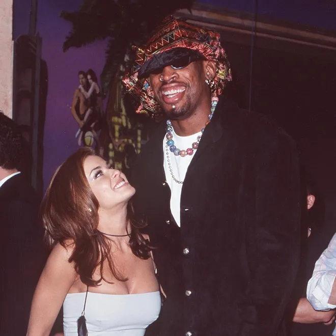Carmen Electra smiling and posing for a photo.