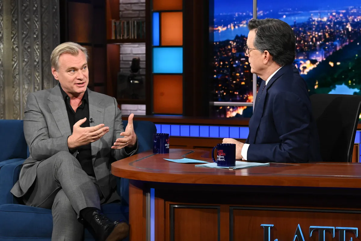 Christopher Nolan smiling during an interview.