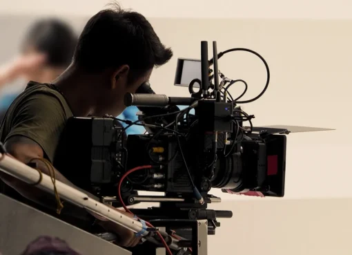Film crew with cameras on a vibrant Culver City street.