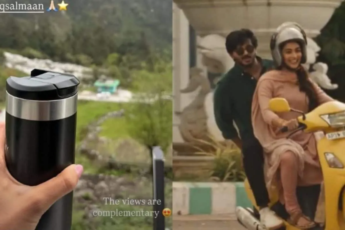 Pooja Hegde smiling on a film set, possibly with Dulquer Salmaan nearby.