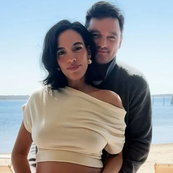 Danielle Olivera smiling, announcing her pregnancy.