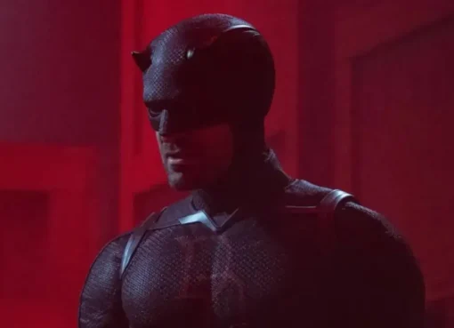 Daredevil in his red suit, leaping across a dark, rainy city skyline.