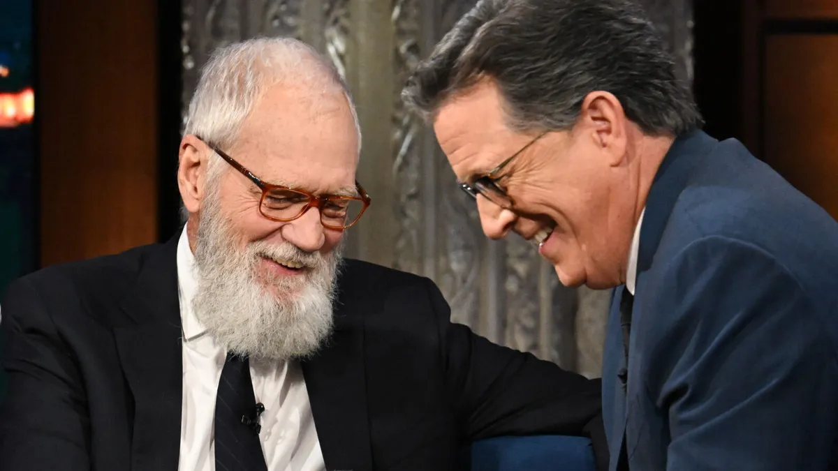 David Letterman looking serious during an interview about CBS