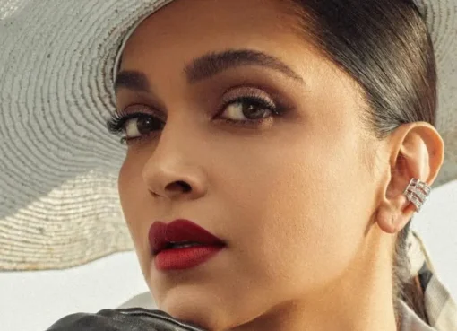Pregnant Deepika Padukone smiling during a photoshoot.