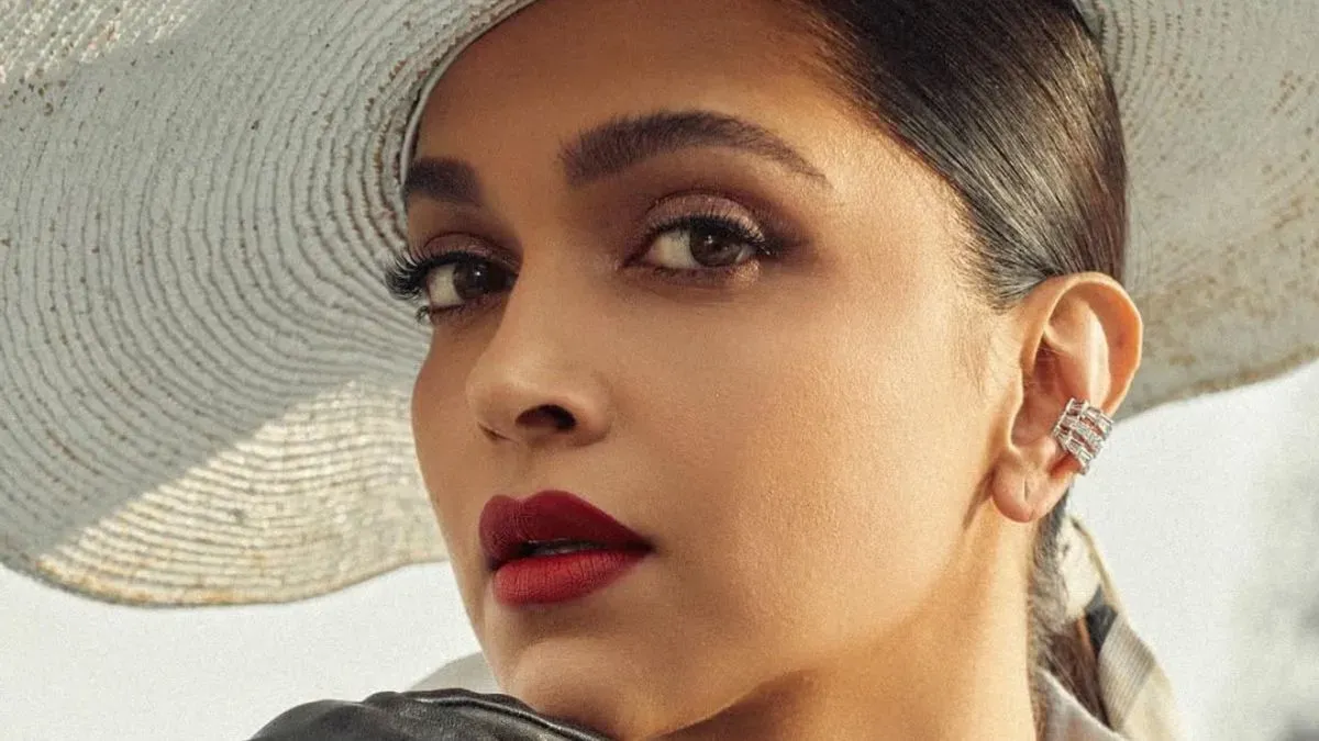 Pregnant Deepika Padukone smiling during a photoshoot.