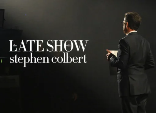 Stephen Colbert smiling on stage