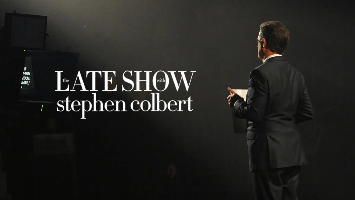 Stephen Colbert smiling on stage