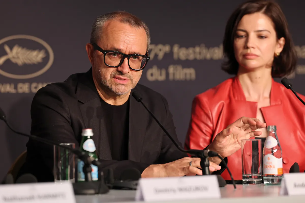 Andrey Zvyagintsev smiling at the Cannes Film Festival.