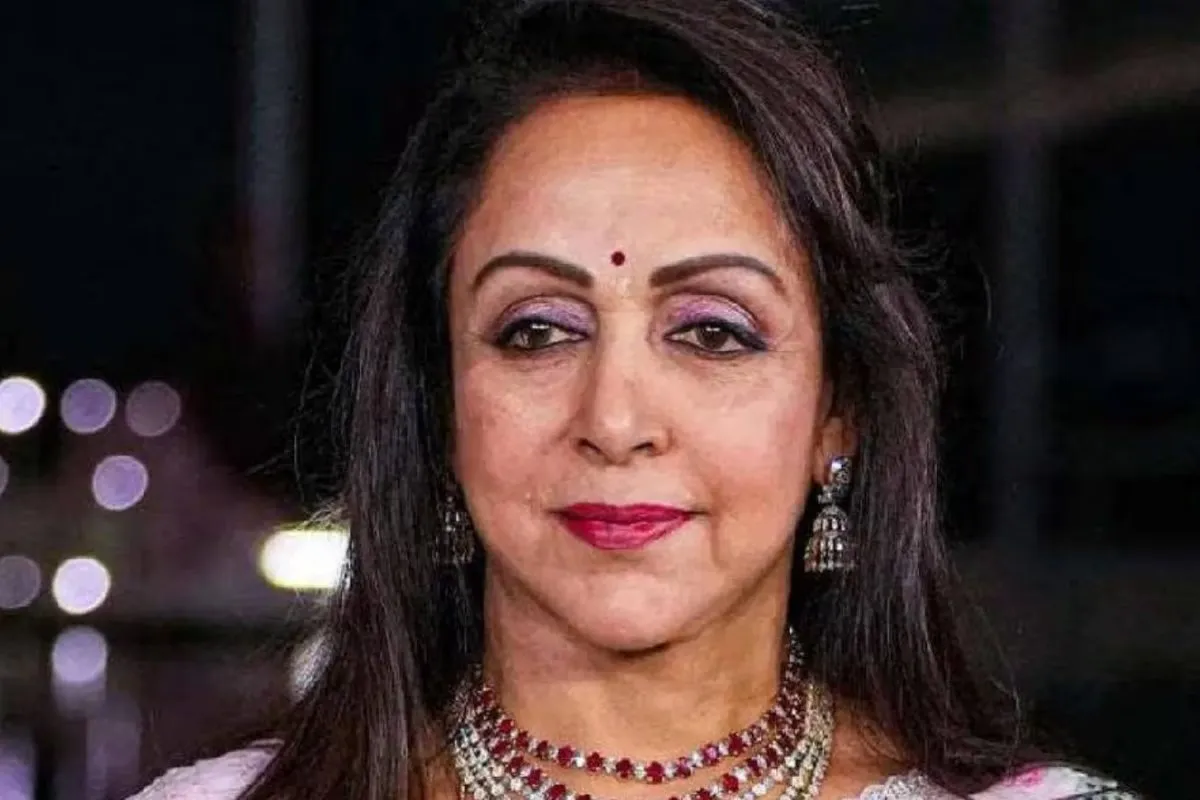 Hema Malini smiling on stage during a performance.
