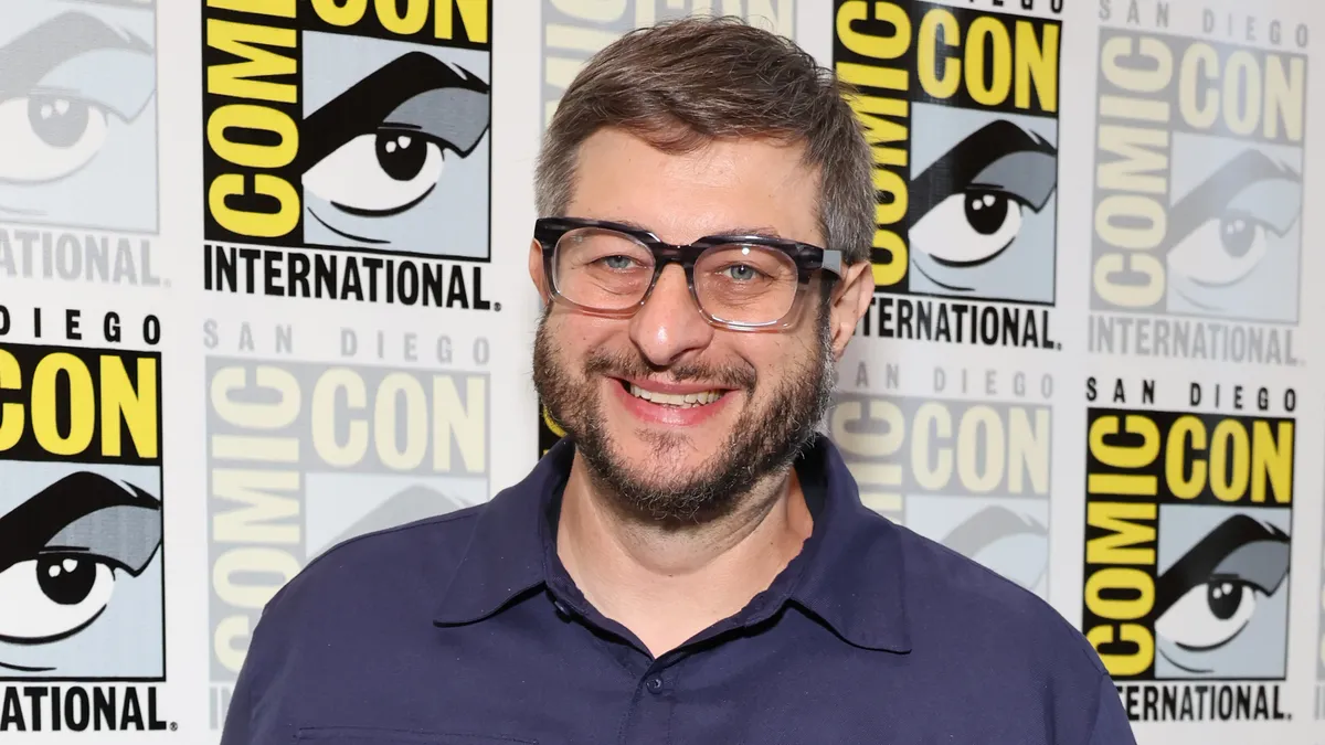 Eugene Mirman smiling during his comedy special