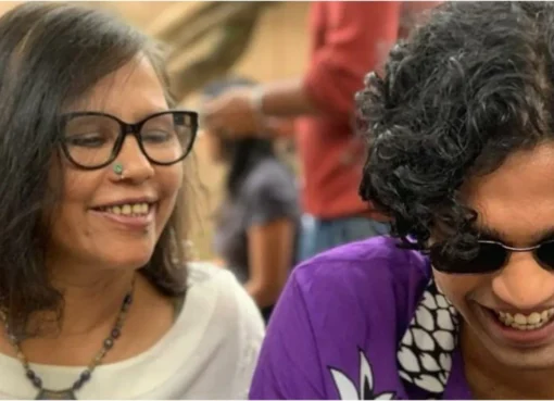 Sutapa Sikdar smiling warmly, with a subtle glow around her, conveying a mother's love.