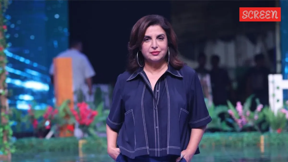 Filmmaker and choreographer Farah Khan smiling warmly at an event.