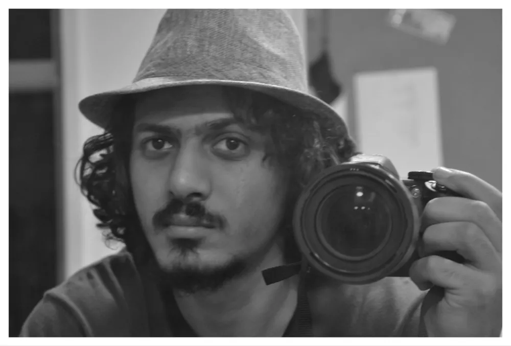 Portrait photo of Omar Salah Marei, an Egyptian filmmaker, with a gentle smile.