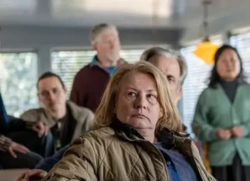 A person watching a show on a tablet, possibly 'From' Season 4 Episode 5, with headphones on, in a comfortable setting.