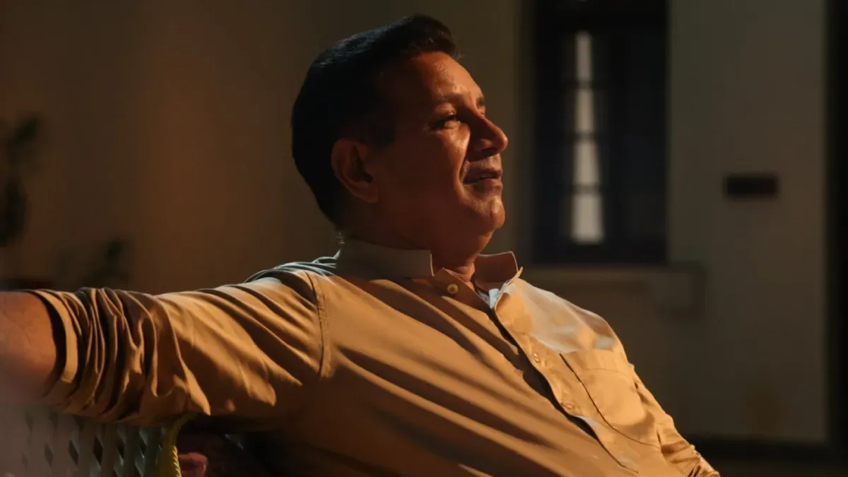 Kumud Mishra, smiling subtly, perhaps during an interview or on set, hinting at the colorful world of 'Satrangi Badle Ka Khel'.