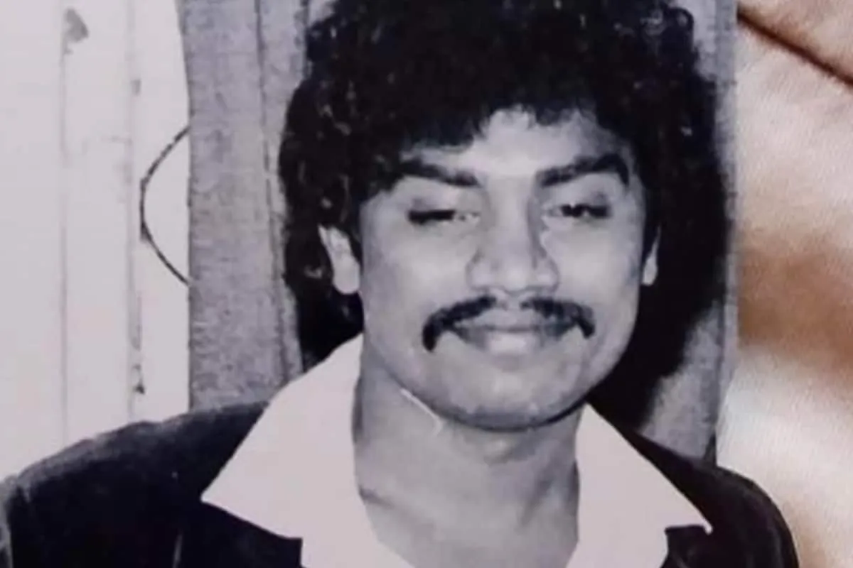 A smiling man, known for his comedic acting, looking successful.