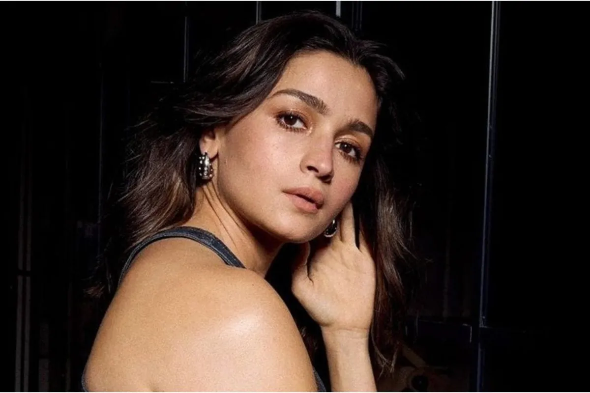 Alia Bhatt looking intense, possibly in a dark, action-packed scene.