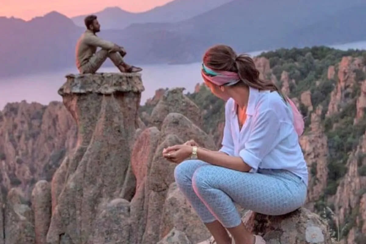 Ranbir Kapoor and Deepika Padukone in a romantic scene from the movie Tamasha, looking at each other intensely.