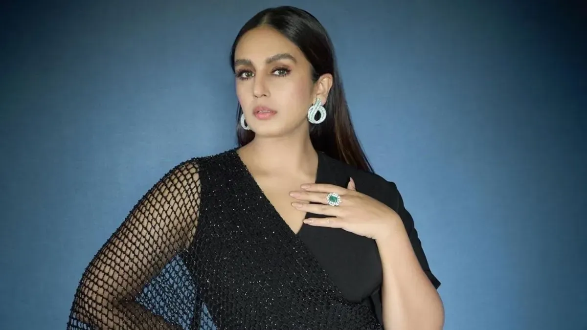 Huma Qureshi smiling during a candid conversation.