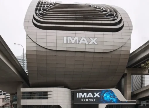 A large IMAX movie theater screen showing a colorful film.