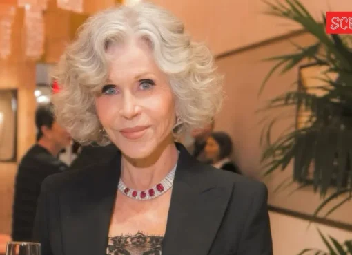 Jane Fonda smiling, looking thoughtful.
