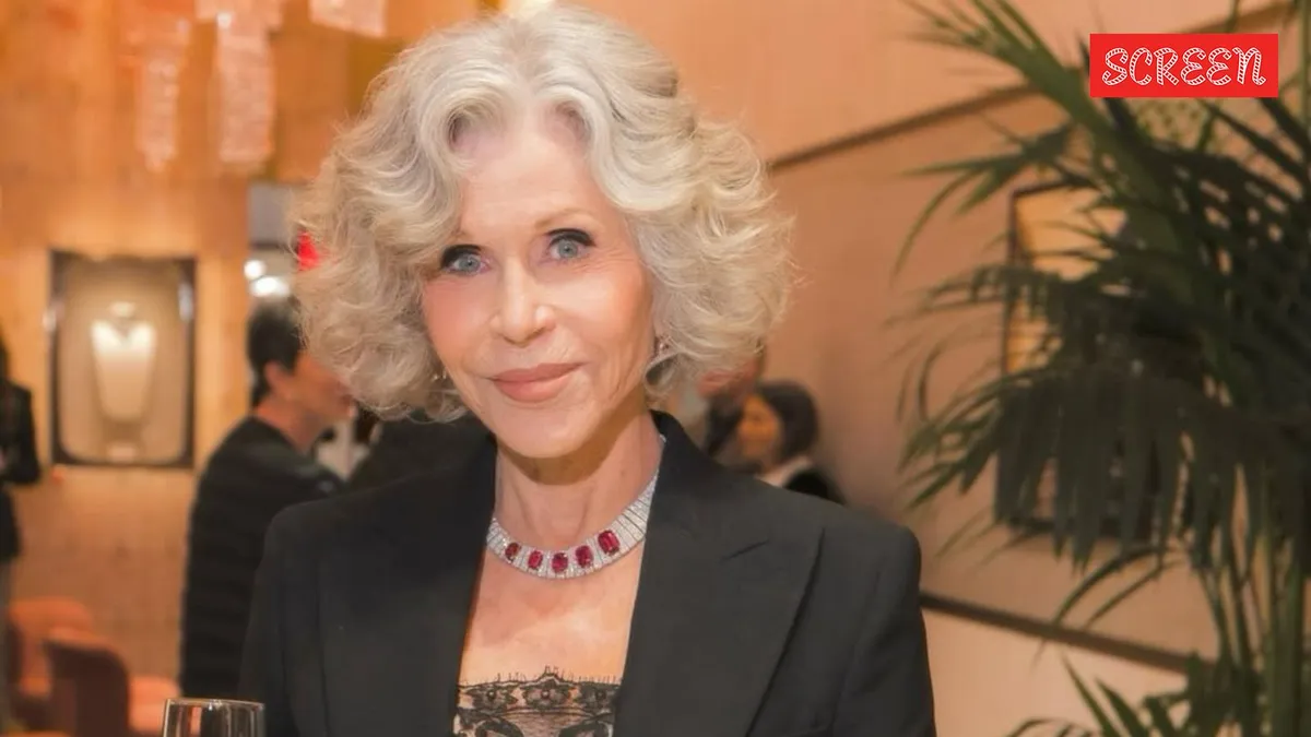 Jane Fonda smiling, looking thoughtful.