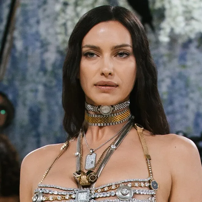 Irina Shayk on the Met Gala red carpet wearing a tiny, art-inspired top.
