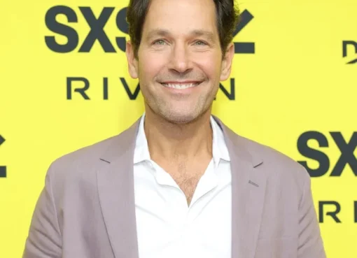 Paul Rudd smiling warmly, looking incredibly youthful.