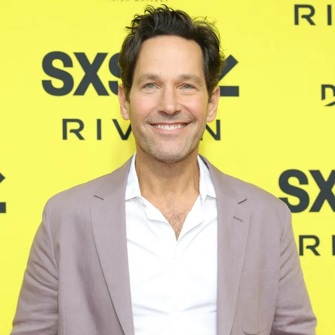 Paul Rudd smiling warmly, looking incredibly youthful.