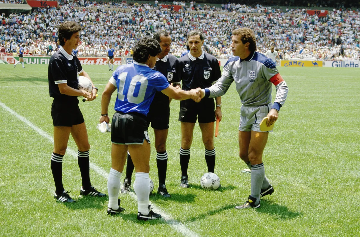 A vibrant football stadium from the 1986 World Cup, showing players in action with a crowd cheering.