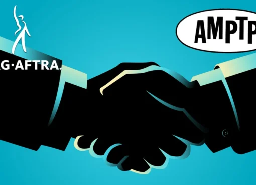A handshake over a movie clapboard