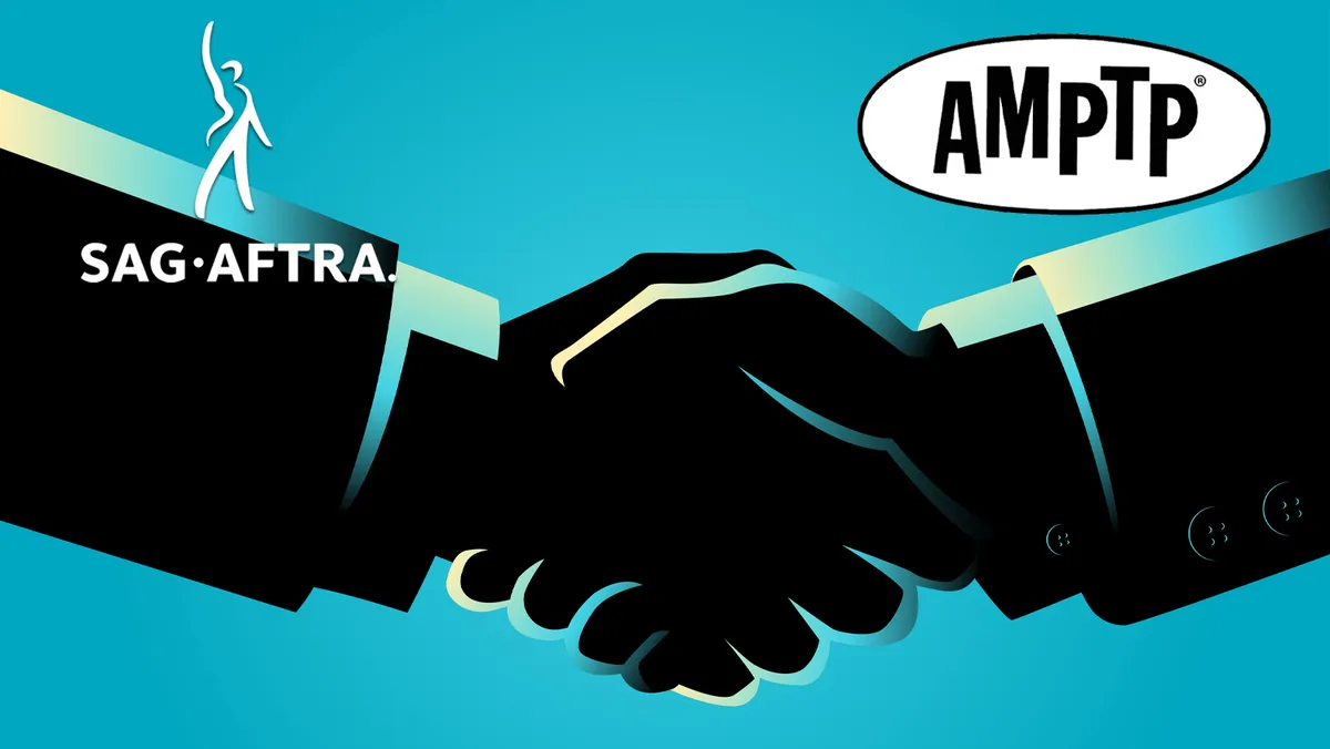 A handshake over a movie clapboard