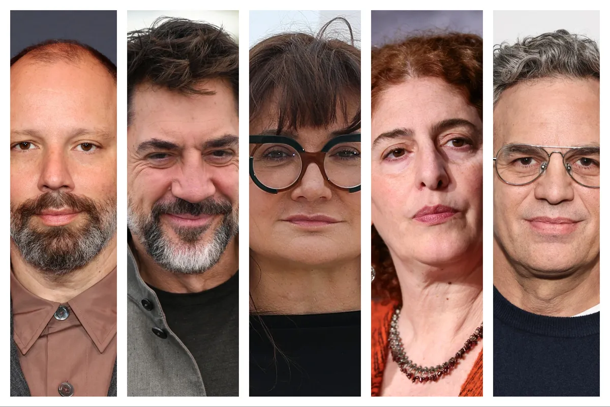 A group of diverse filmmakers and actors, including Javier Bardem and Mark Ruffalo, signing an important open letter against media control.