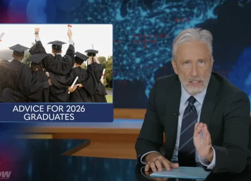 Jon Stewart hosting the Daily Show and looking at the camera