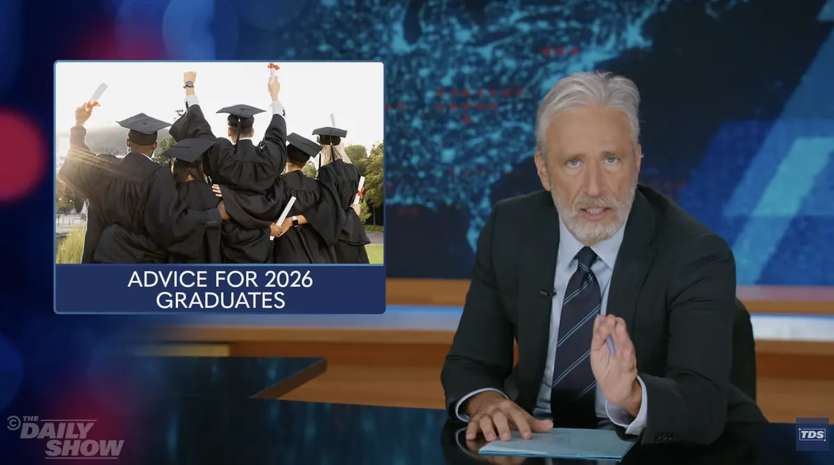 Jon Stewart hosting the Daily Show and looking at the camera