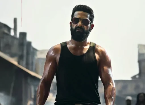 A gritty and dark movie poster for the film Dragon starring Jr NTR
