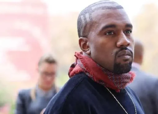 Kanye West performing on stage.
