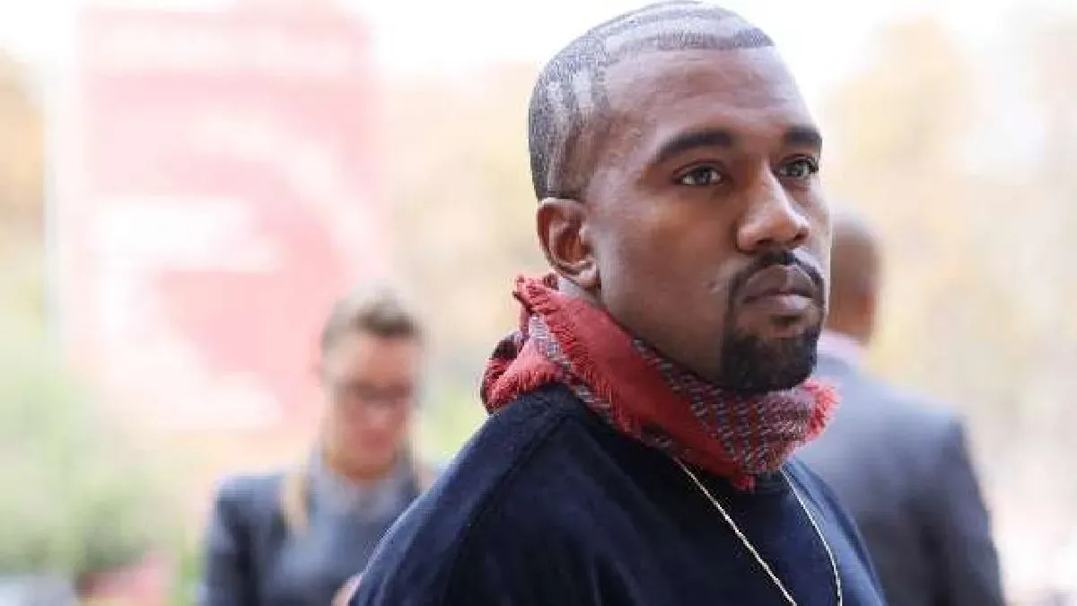 Kanye West performing on stage.