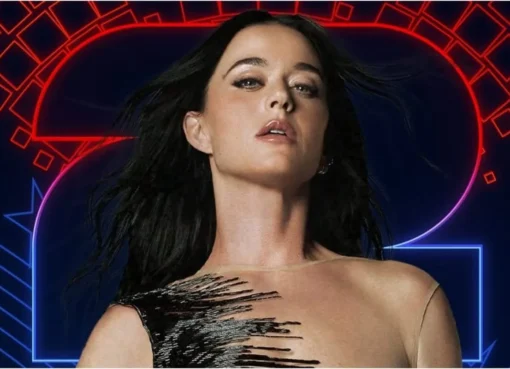 Katy Perry smiling on stage, perhaps performing