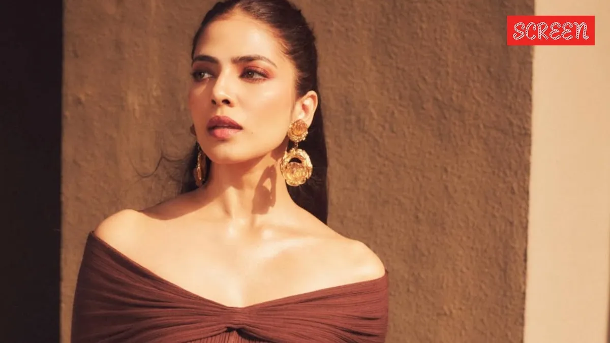 Malavika Mohanan speaking at an event, looking thoughtful and direct.