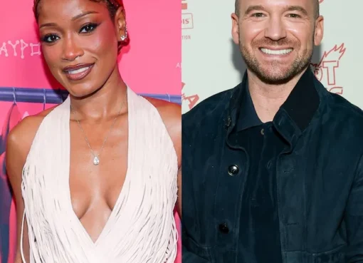 Keke Palmer and Sean Evans smiling and talking on a TV set.